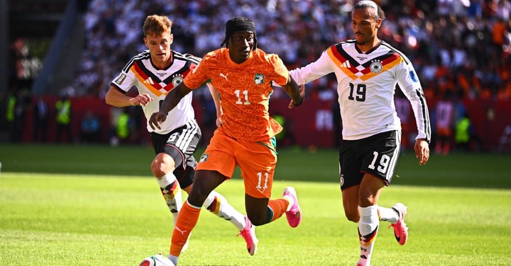 Yan Diomandé dispute le ballon avec Joshua Kimmich et Leroy Sané lors du match Allemagne-Côte d’Ivoire à la Coupe du monde 2026.